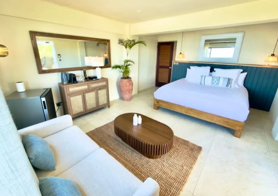 King bed inside a Mer et Sel Suite on Union Island